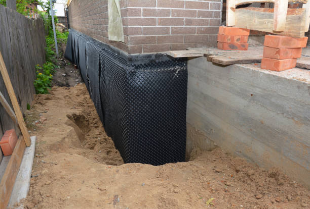Happy homeowners after waterproofing job in Winfield